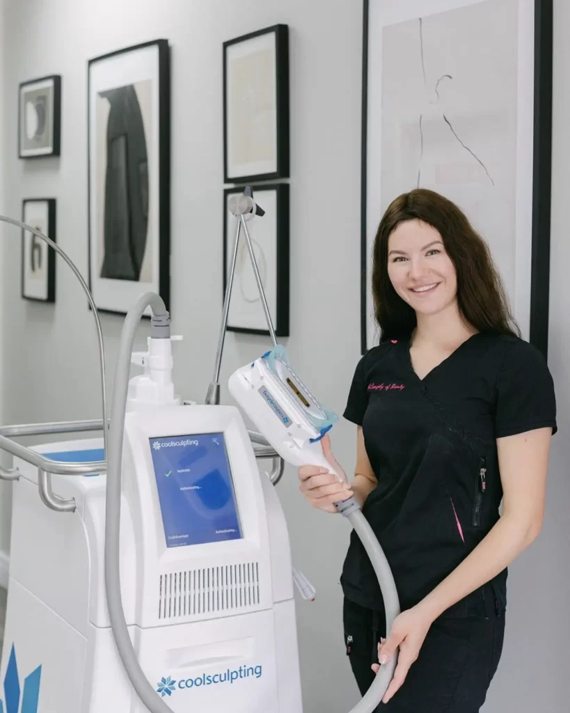 A nurse holding a coolsculpting device at Philosophy of Beauty Clinic in Toronto